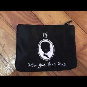 Black makeup/jewelry pouch. Never used.